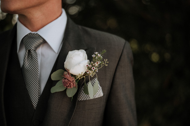 closeup-shot-male-wearing-tuxedo-with-boutonniere-its-pocket_181624-3585